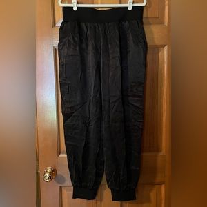 Elie Tahari silk like joggers. Never worn. Black. Size Large.